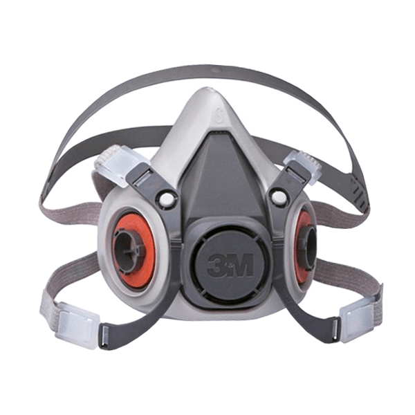 Un respirador de media cara marca 3m con filtros redondos dobles rojos y negros. La máscara es gris con una válvula central negra y correas blancas ajustables para asegurarla alrededor de la cabeza.