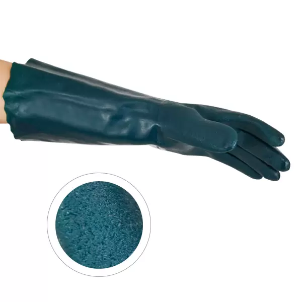 Una imagen en primer plano de una mano derecha con un guante de goma verde azulado oscuro. hay un círculo insertado que muestra una vista de textura en primer plano del material granular del mismo color que el guante.