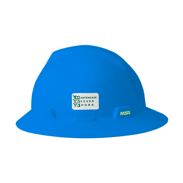 Un casco azul brillante con una pegatina de seguridad verde y blanca que dice "manténgase seguro 1 hora" e incluye un logotipo de la marca msa en el frente. el casco tiene una superficie lisa y un ligero brillo.