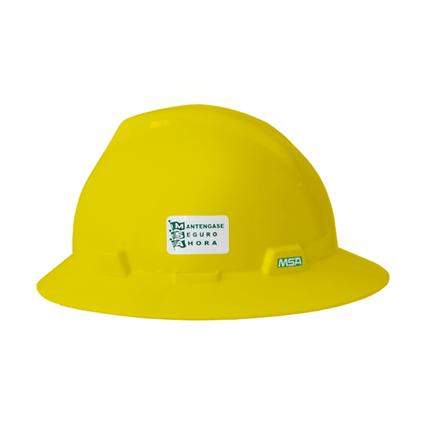 Un casco de seguridad de color amarillo vibrante con un logo verde y azul en el frente que dice "manténgase seguro 24 hora" y las iniciales "msa". el casco tiene una textura suave y brillante.
