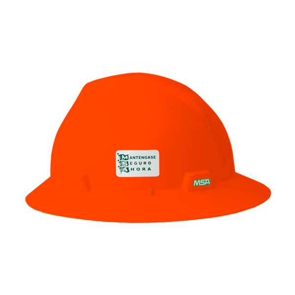 Casco de seguridad de color naranja brillante con una pegatina de seguridad verde y blanca en el frente que dice "manténgase seguro a toda hora". El casco tiene un acabado suave y brillante y un diseño curvo para proteger la cabeza.